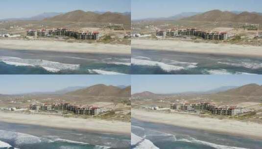 航拍美丽的海滩前的建筑物高清在线视频素材下载