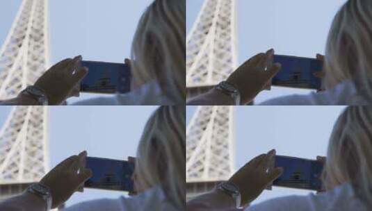 女人用手机拍摄埃菲尔铁塔高清在线视频素材下载