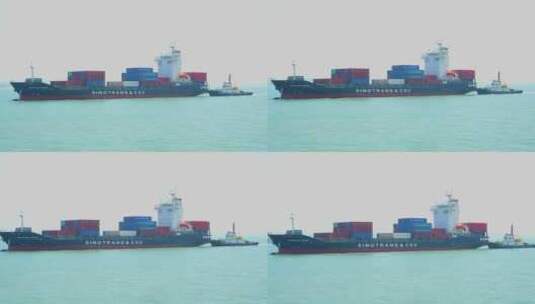 海上行驶的货轮进港牵引船高清在线视频素材下载