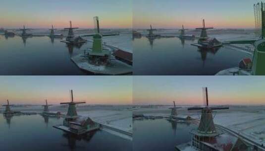 Zaanse Schans风车村的木制风力磨坊在冬季与雪景雪高清在线视频素材下载