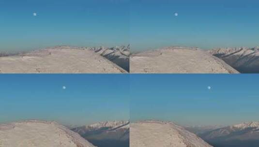 航拍月亮下的雪山高清在线视频素材下载
