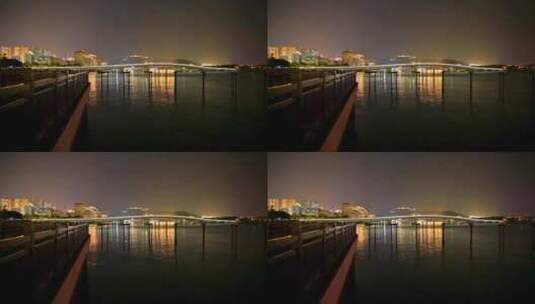 海南三亚夜晚凤凰岛海面灯光倒影夜景高清在线视频素材下载
