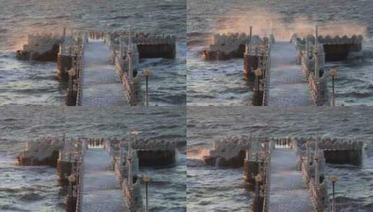 威海高区金海湾国际饭店栈桥上海冰与海浪高清在线视频素材下载