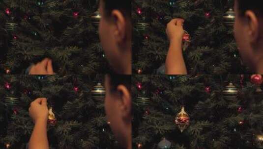 男人把装饰品挂在圣诞树上高清在线视频素材下载