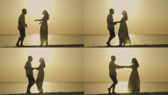 日落时分海滩跳舞的夫妇高清在线视频素材下载