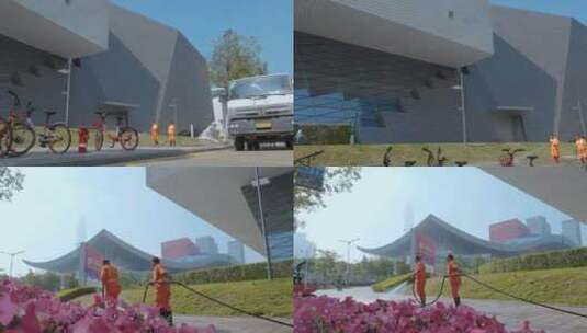 深圳博物馆旁抽水车洗地的环卫工高清在线视频素材下载