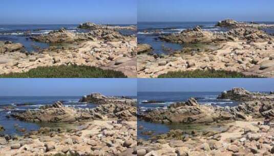蓝天下的海边岩石高清在线视频素材下载