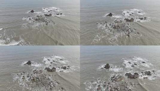 阴天海水沙滩航拍礁石海岸石头俯拍海上岩石高清在线视频素材下载