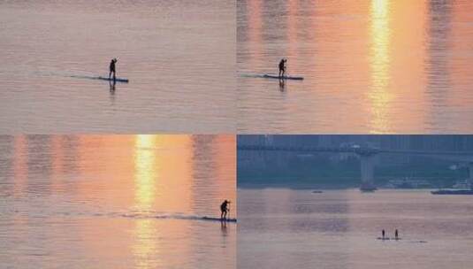 皮划艇从夕阳下滑过高清在线视频素材下载