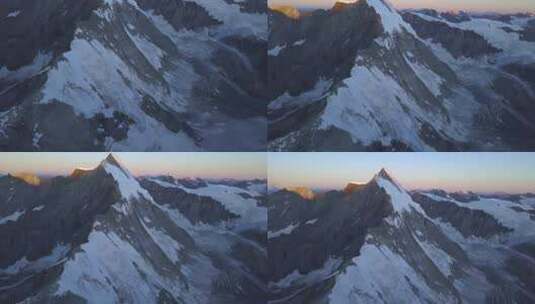 航拍晨光下的雪山高清在线视频素材下载