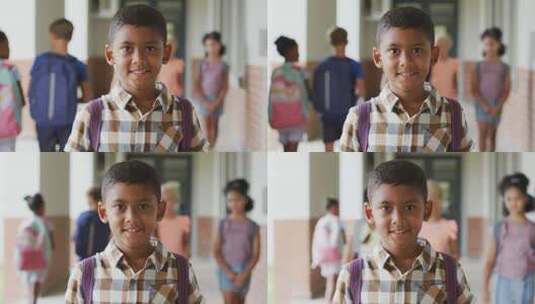 快乐的混血儿男孩站在学校走廊的视频高清在线视频素材下载