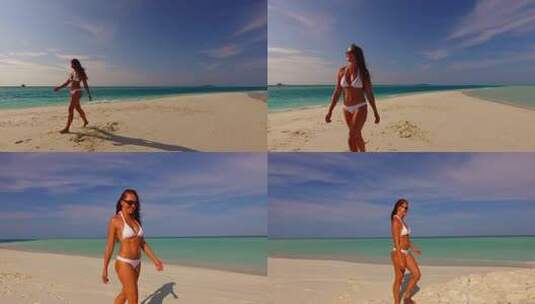美丽的美女模特在天堂白沙和蓝色的海滩上晒太阳放松高清在线视频素材下载