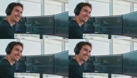 戴耳机男子办公电脑前微笑高清在线视频素材下载