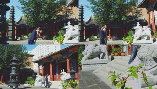 僧人引领香客进入寺院大殿高清在线视频素材下载