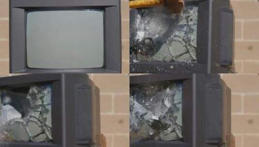 用锤子砸碎旧电视机屏幕高清在线视频素材下载