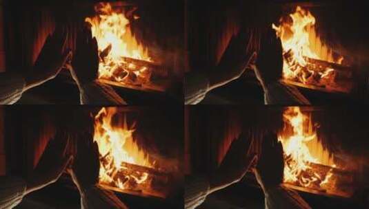 女人在壁炉旁取暖高清在线视频素材下载