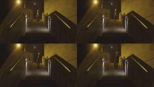 怪异的男人走下台阶横屏高清在线视频素材下载