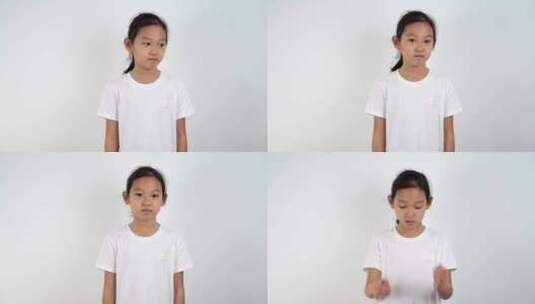 在白色背景前做各种表情的亚洲女孩高清在线视频素材下载
