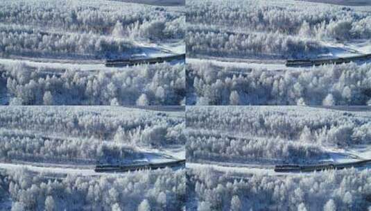 航拍列车穿行在林海雪原之中高清在线视频素材下载