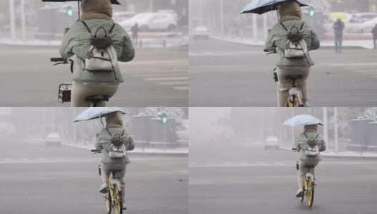 下雪天骑自行车的女孩背影高清在线视频素材下载