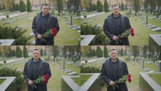 男人拿着一束玫瑰在墓地行走高清在线视频素材下载