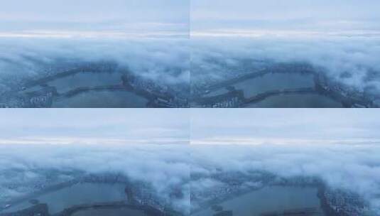 云雾下的江西省九江市城市景观航拍视频高清在线视频素材下载