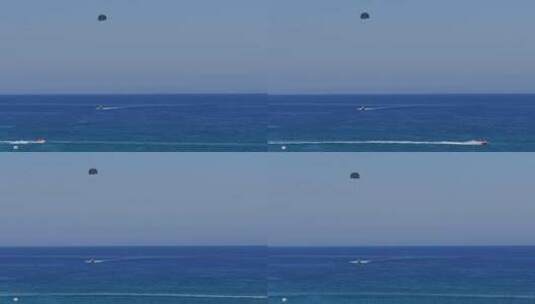 蓝色大海中的滑翔伞和喷气滑雪高清在线视频素材下载
