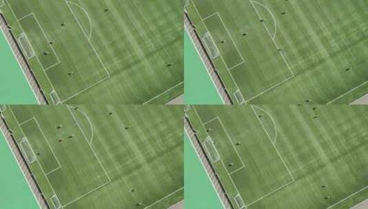 职业足球俱乐部在训练中射门的自上而下的空中镜头。高清在线视频素材下载