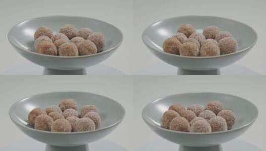 中式点心盘子里的山楂甜品果丹皮山楂球特写高清在线视频素材下载