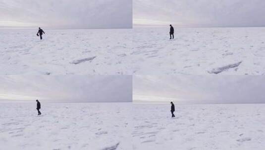 航拍在冰川湖面上的男人高清在线视频素材下载