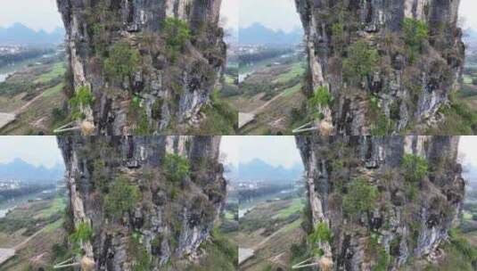 航拍攀登桂林阳朔矮山的攀岩者高清在线视频素材下载