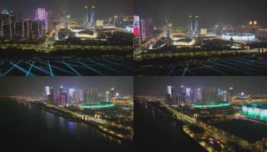 杭州奥体中心杭州之门灯光秀夜晚夜景航拍亚高清在线视频素材下载
