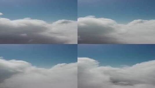 无人机飞越多雾和蓬松的云层空中垂直视图蓝高清在线视频素材下载