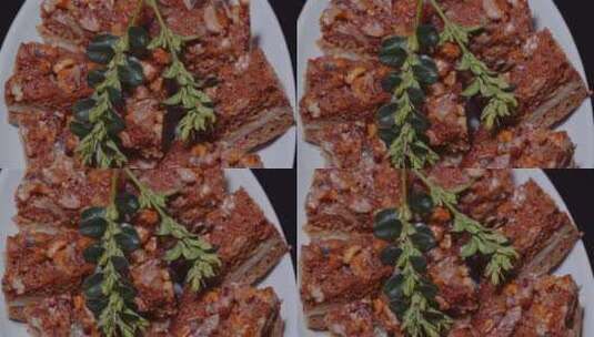 盘子上蛋糕片顶部的橄榄枝装饰高清在线视频素材下载