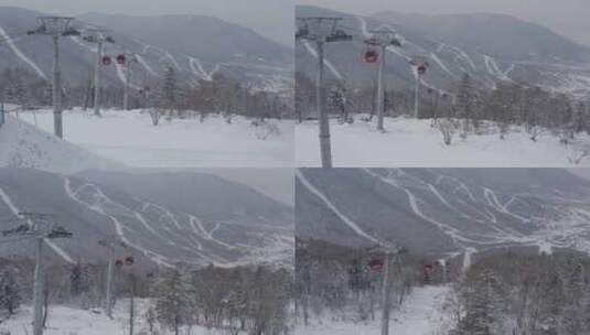 航拍吉林省吉林市北大湖滑雪场的吊厢缆车高清在线视频素材下载