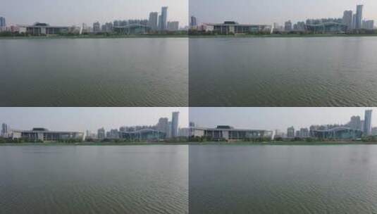 武汉琴台航拍两栋建筑主水面荷花高清在线视频素材下载