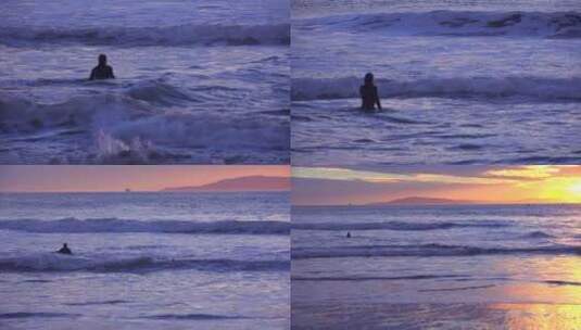 在日落时一名冲浪者穿过海浪高清在线视频素材下载