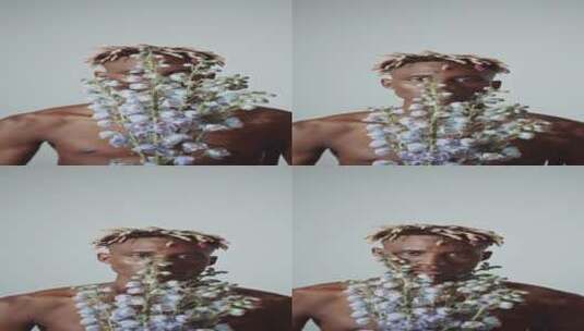 男人用鲜花覆盖着他的脸高清在线视频素材下载