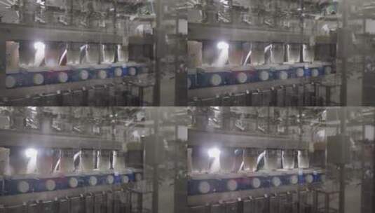 自动化生产线上的乳品生产牛奶灌装过程高清在线视频素材下载