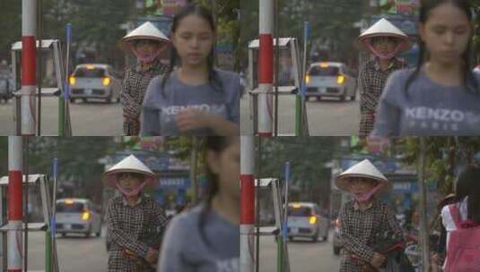 越南女士站在街道上高清在线视频素材下载
