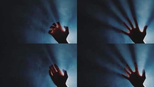 黑暗中挣扎的男人的手剪影高清在线视频素材下载