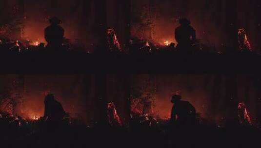 夜晚消防员在森林里灭火剪影高清在线视频素材下载