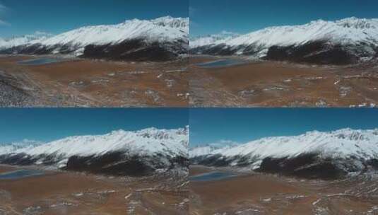 雪山平原视频青藏高原延绵的雪山峡谷湖泊高清在线视频素材下载