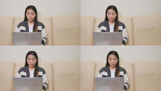 亚洲中国女性居家坐沙发办公玩手机上网购物高清在线视频素材下载