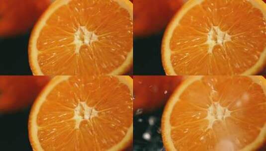 切开的橙子水花四溅高清在线视频素材下载
