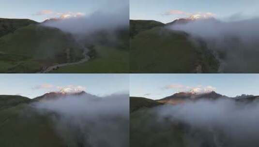 航拍格聂神山日出日照金山平流雾高清在线视频素材下载