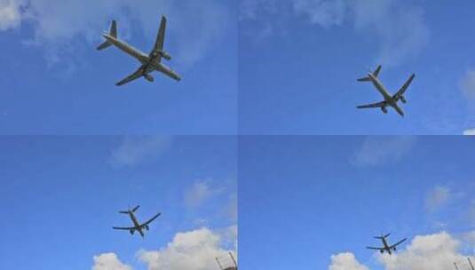 仰拍天空中准备降落的飞机高清在线视频素材下载