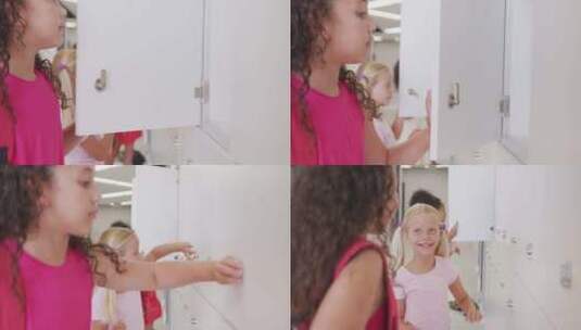 快乐多样化女孩打开学校储物柜的视频高清在线视频素材下载