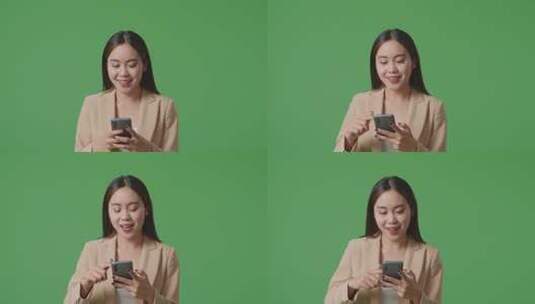 亚洲商务女性使用手机和走在绿屏色度键的特写高清在线视频素材下载