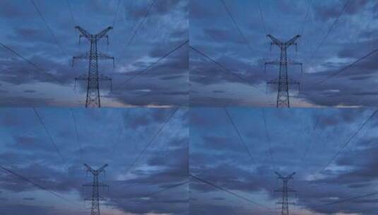 傍晚时分电网高压电铁塔航拍高清在线视频素材下载